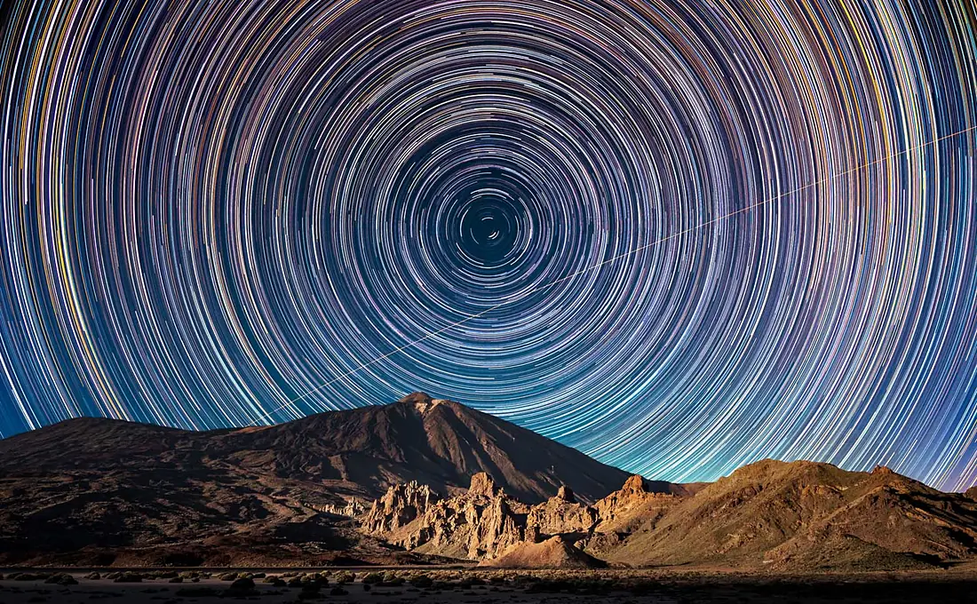 Circumpolar star trails and ISS transit over the Teide volcano, Tenerife, Spain
